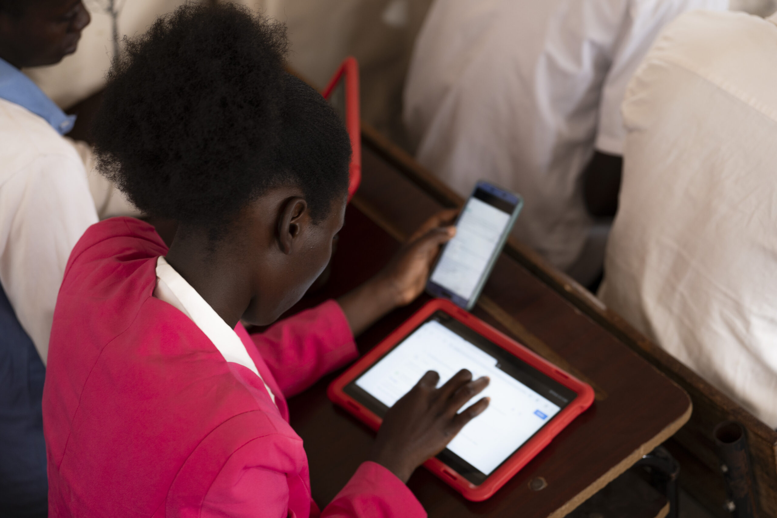 Mozambique. Empowered by digital education: Asylum seeker Izere studies hard to become a doctor. Credit: UNHCR/Lara Bommers